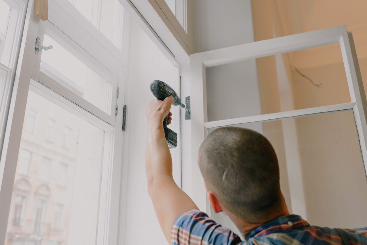 PropHub - Handyman repairing tenant damage to window
